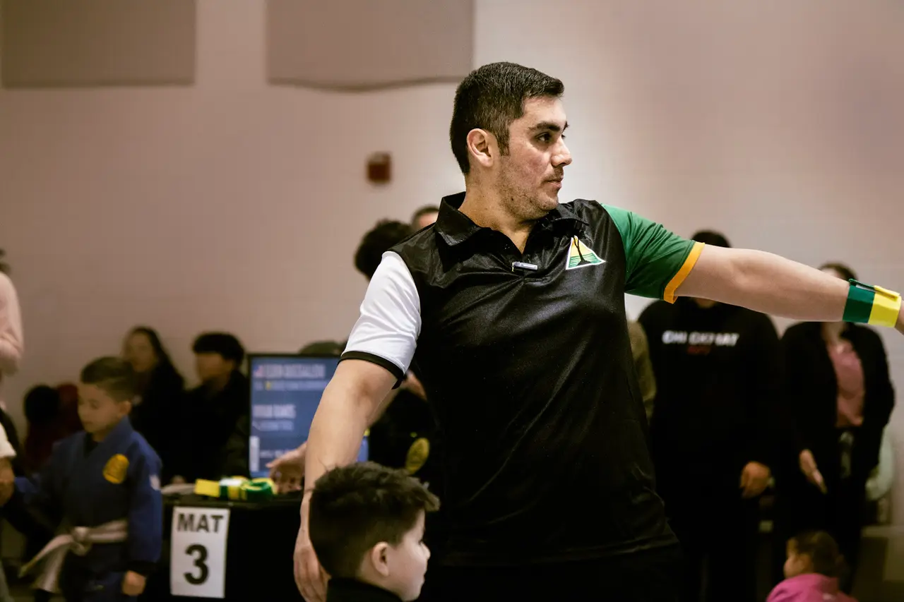 An RGV Open referee signals during a match at Mat 3 in McAllen.